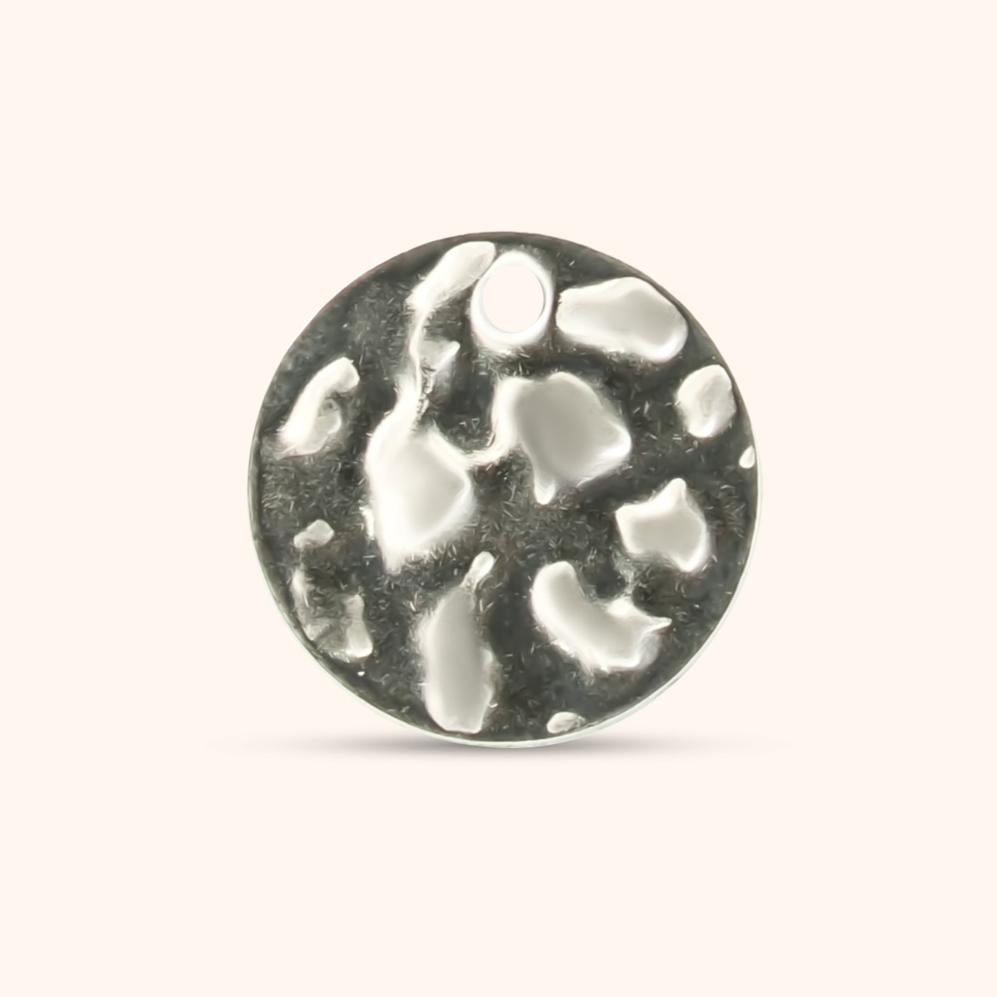Round hammered silver charm with a small top hole, made of polished stainless steel